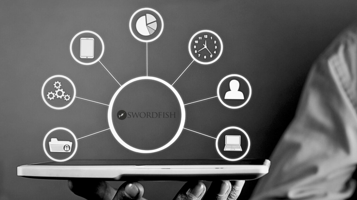 The image shows a laptop being held up, with various icons arranged in a circular pattern